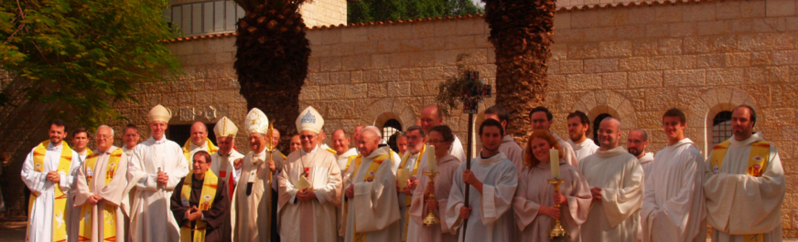 Bishops, monks, guest priests and volunteers in front of the basilica.