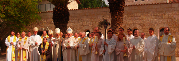 Bishops, monks, guest priests and volunteers in front of the basilica.